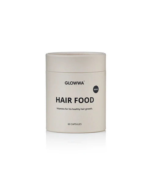 A cylindrical white jar of GLOWWA Hair Food capsules, featuring a minimalist label with black text, set against a clean white background with a soft reflection.
